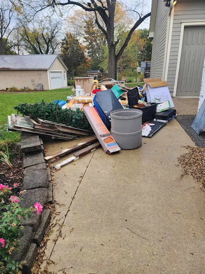 Dumpster being loaded with debris for Residential Dumpster Rental in Easley